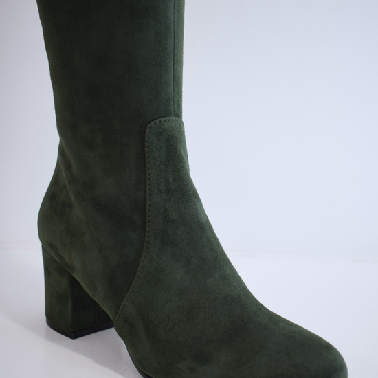 Tall green suede boot with block heel and inside zip fastening