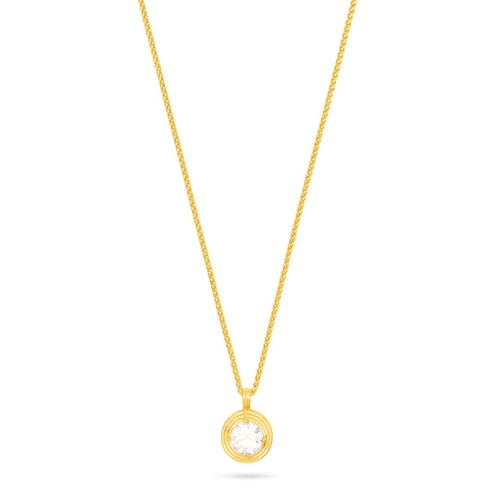 A delicate yellow gold chain necklace with a small circular pendant featuring a clear round gemstone, displayed against a solid white background.
