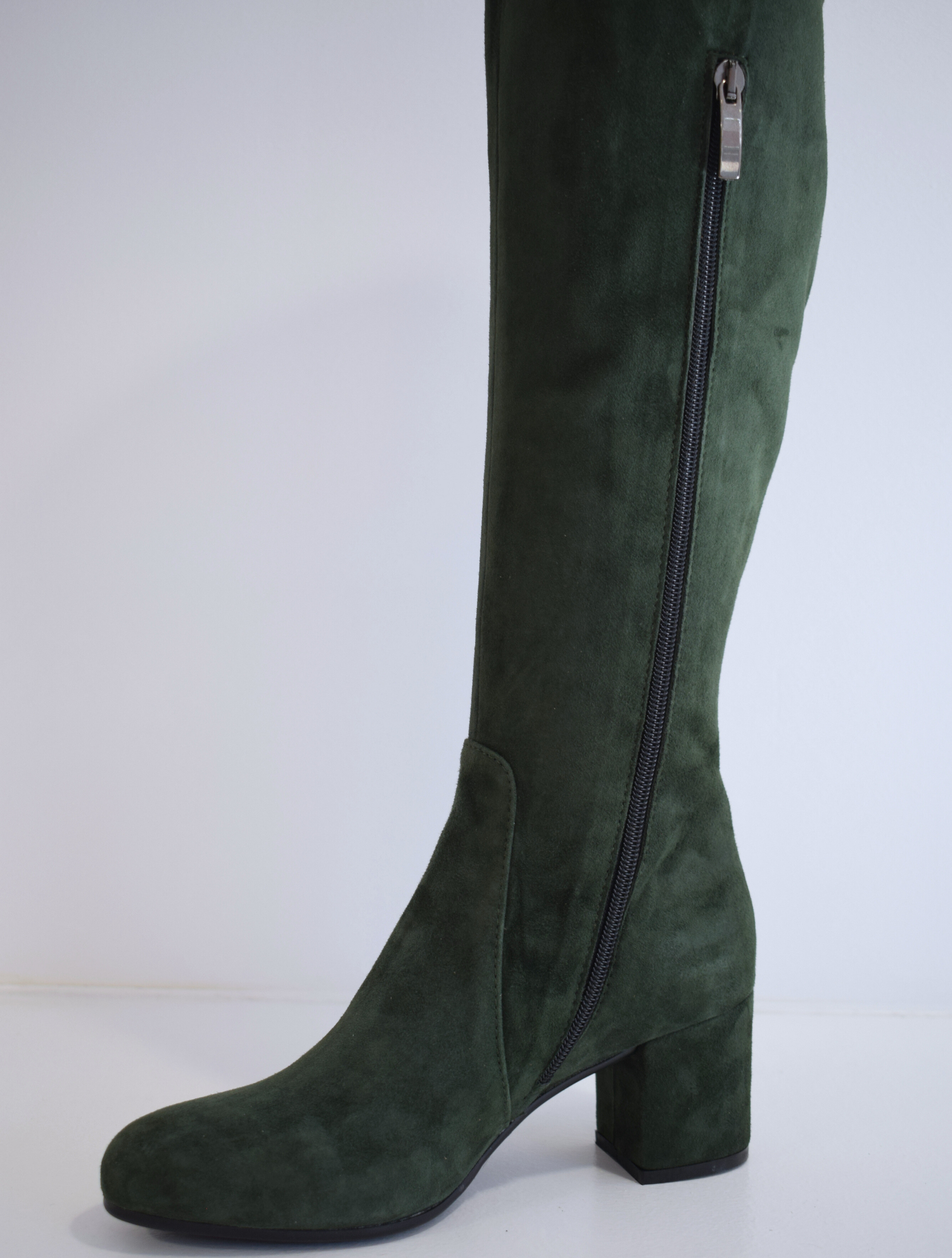 Tall green suede boot with block heel and inside zip fastening