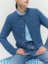 blue cotton blend cardigan with fringe detail, gold buttons and round neck close up