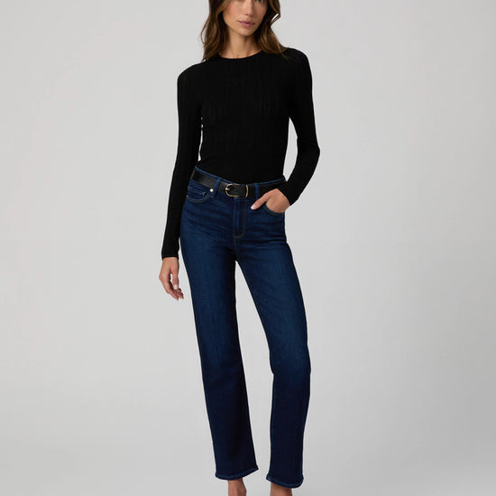 Dark wash stretch skinny jeans on model wearing long sleeve tee