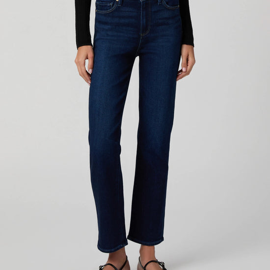 Dark stretch denim worn with pointed flat shoes from Paige