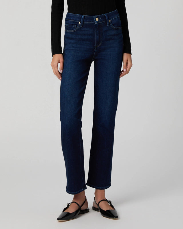 Dark stretch denim worn with pointed flat shoes from Paige