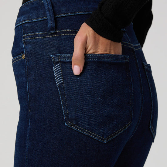 Close up pocket detail of dark wash denim