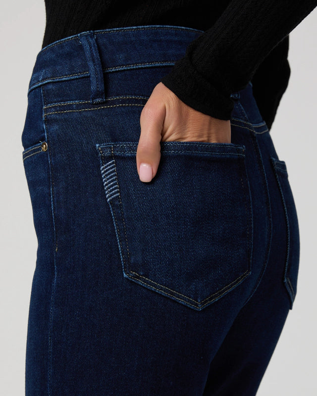 Close up pocket detail of dark wash denim