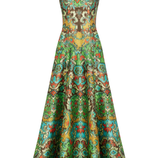 A sleeveless A-line maxi dress with a brown bodice and a vibrant green, gold, and red patterned skirt, shown against a plain white background.