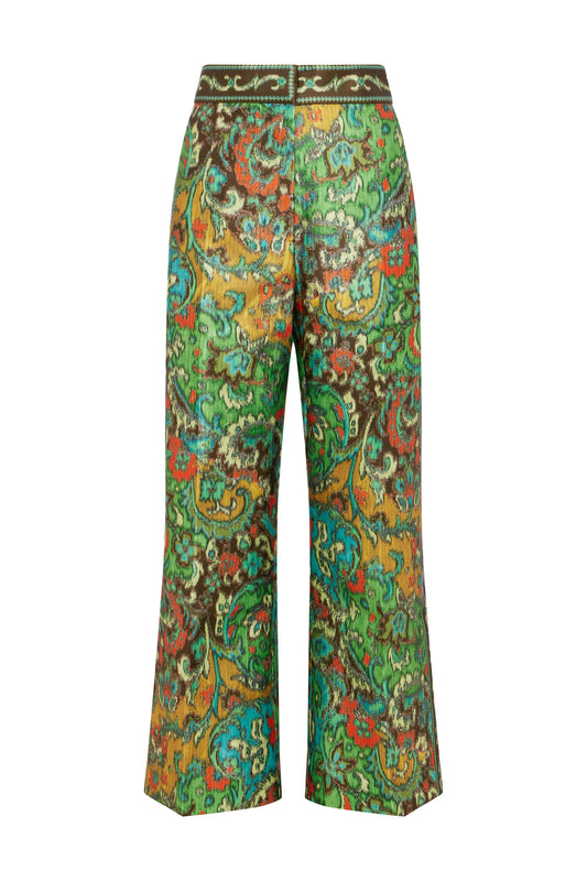 A pair of wide-leg cropped pants featuring a vibrant, multicolored paisley pattern with green, yellow, orange, and blue tones, set against a plain white background.