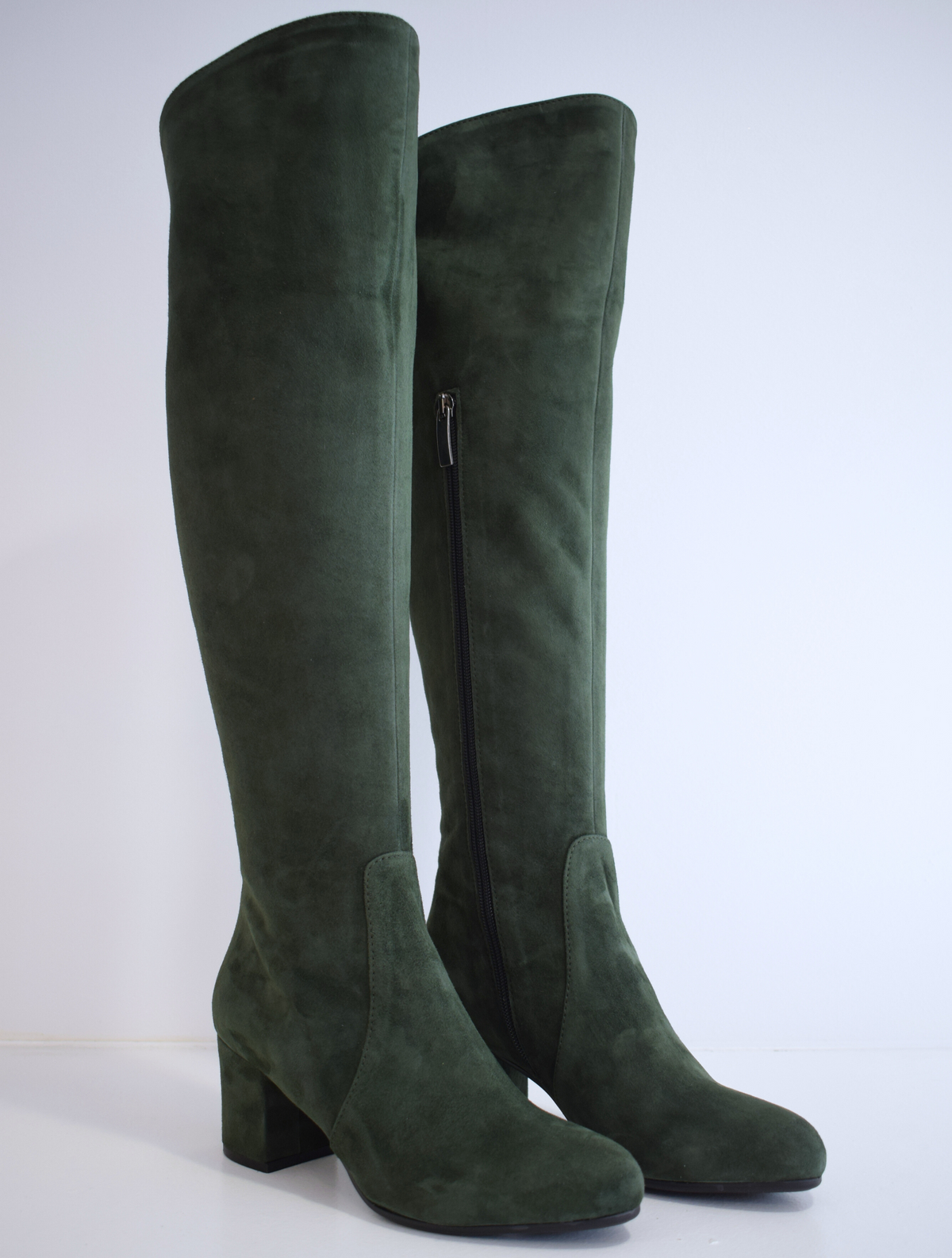 Tall green suede boot with block heel and inside zip fastening
