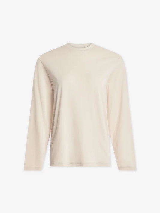 Flat lay of cream round neck long sleeve tee