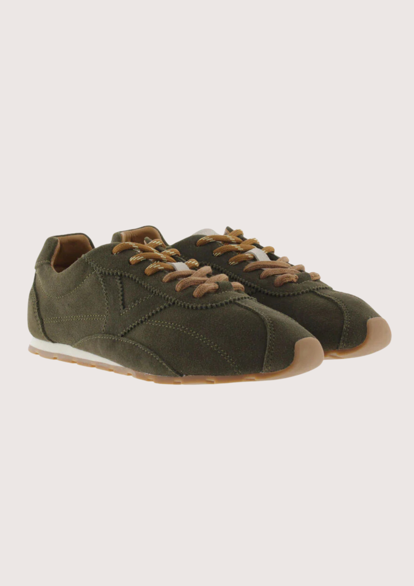 Khaki suede sneaker with beige sole on a plain background
