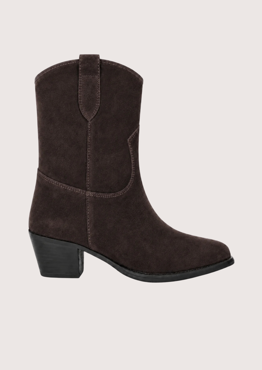 A dark brown suede western-style ankle boot with a low block heel, shown from a side profile against a light gray background.
