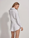 Half zip white sweatshirt with long sleeves and navy piped details rear view