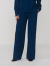 Navy blue outfit with a top and wide-leg pants on a white background