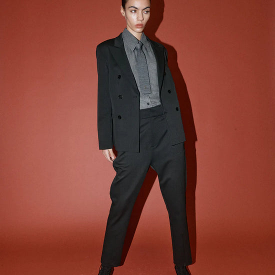 double breasted black blazer with notch lapels and welted flap pockets from heyanno model shot