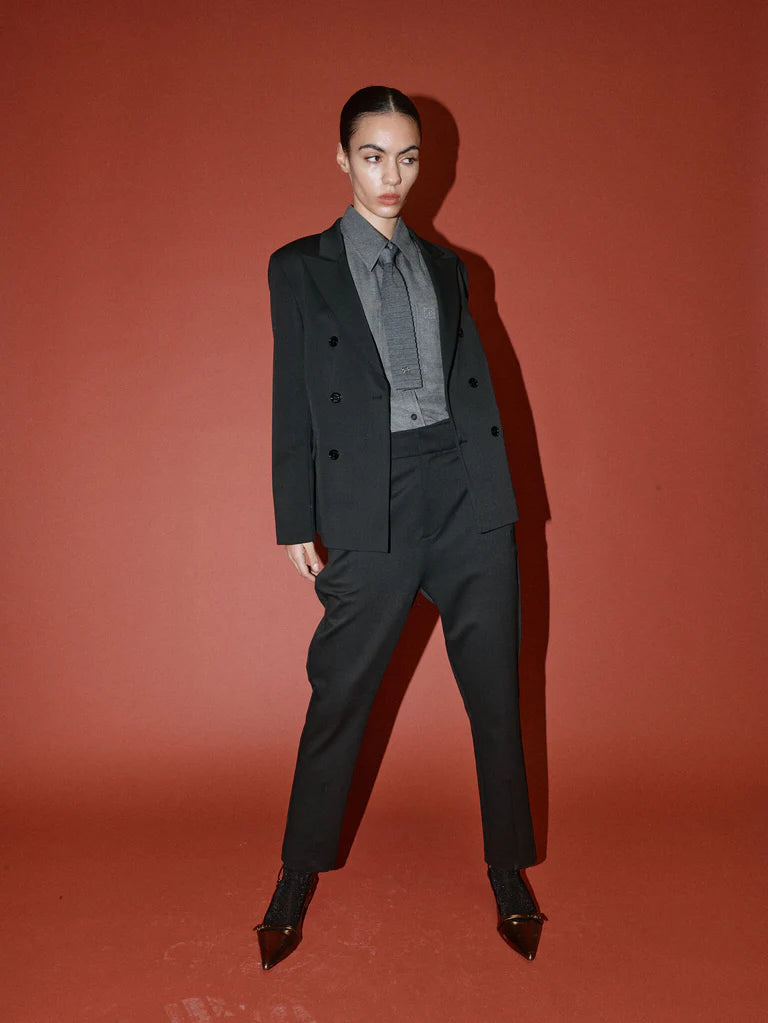 double breasted black blazer with notch lapels and welted flap pockets from heyanno model shot