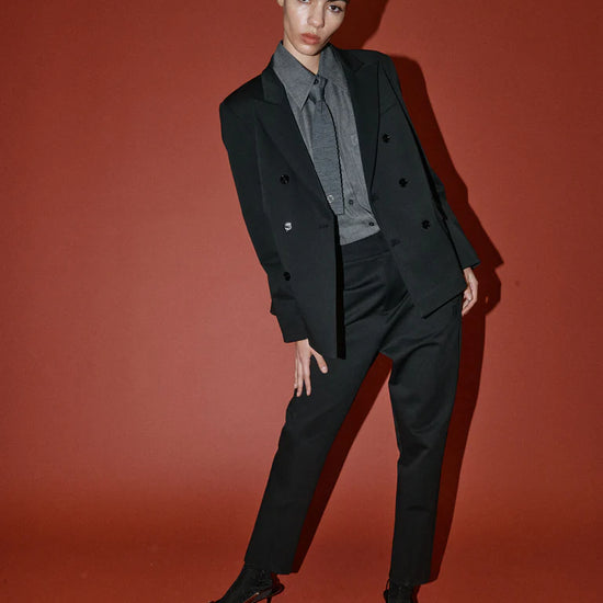 double breasted black blazer with notch lapels and welted flap pockets from heyanno model shot