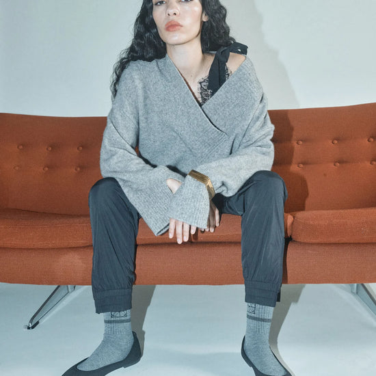 v neck cross over neck grey melange wool mix jumper with relaxed fit from heyanno model shot