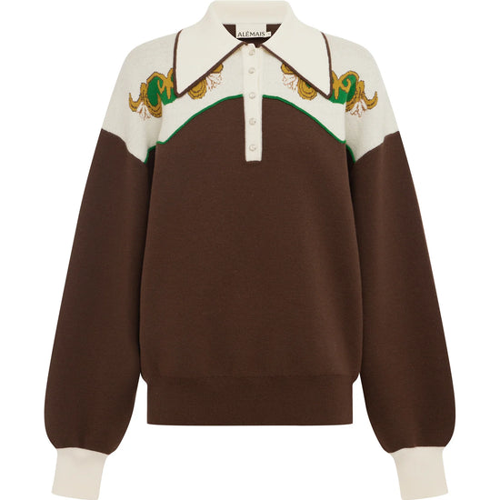 A brown and cream color-blocked knit polo sweater with embroidered snakes on the yoke, displayed on a clean white background.