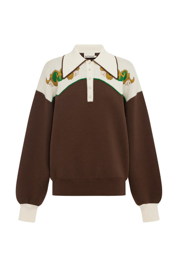A brown and cream color-blocked knit polo sweater with embroidered snakes on the yoke, displayed on a clean white background.