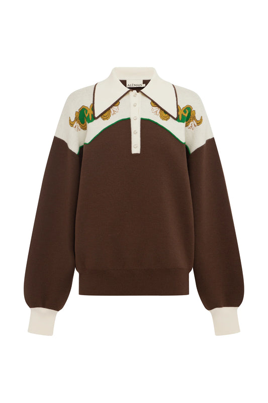 A brown and cream color-blocked knit polo sweater with embroidered snakes on the yoke, displayed on a clean white background.