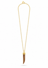A gold chain necklace featuring a long, curved brown bone or horn pendant with gold caps at the top, displayed on a clean white background.