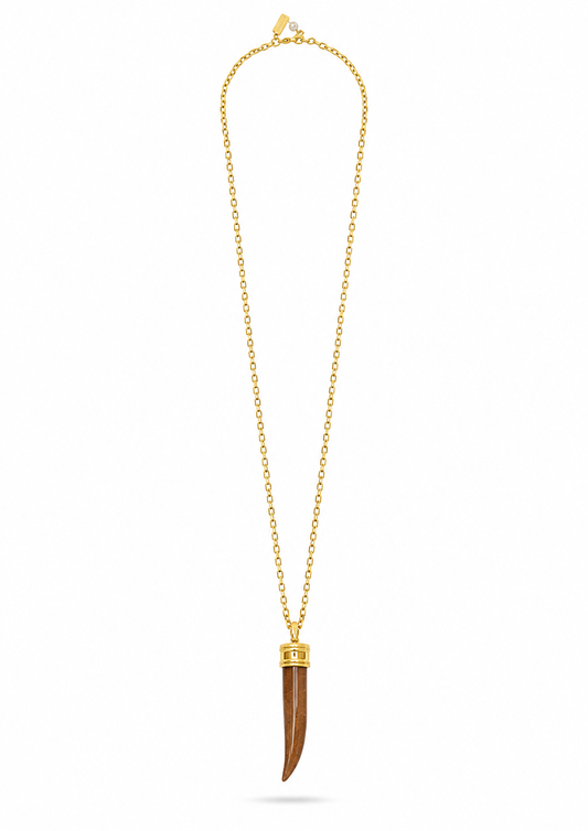 A gold chain necklace featuring a long, curved brown bone or horn pendant with gold caps at the top, displayed on a clean white background.