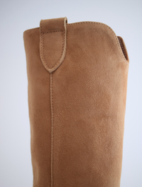 Sand coloured medium length pull on suede western inspired boot