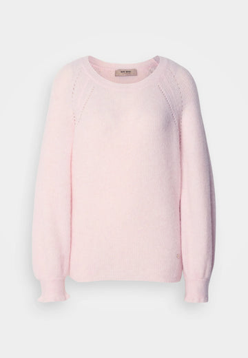 Pink sweater on a light gray background