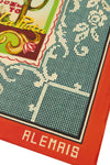 A close-up of a square scarf or bandana featuring a vintage-style print. The design includes a teal grid pattern with white floral scrollwork, a red border, and a decorative multicolor label area with the text 'DEO TO La Plata' and 'ALEMAIS' in white on the red border.