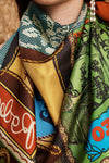 Close-up of a colorful patterned scarf with visible brand name.