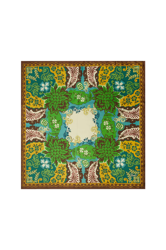 A square scarf with an intricate botanical and floral pattern, featuring shades of green, yellow, brown, and blue, with a central cream-colored square.