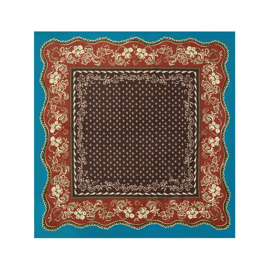 A square bandana scarf with a traditional paisley pattern, featuring a dark brown center, a red border with cream floral details, and a solid turquoise blue outer border, shown flat against a white background.