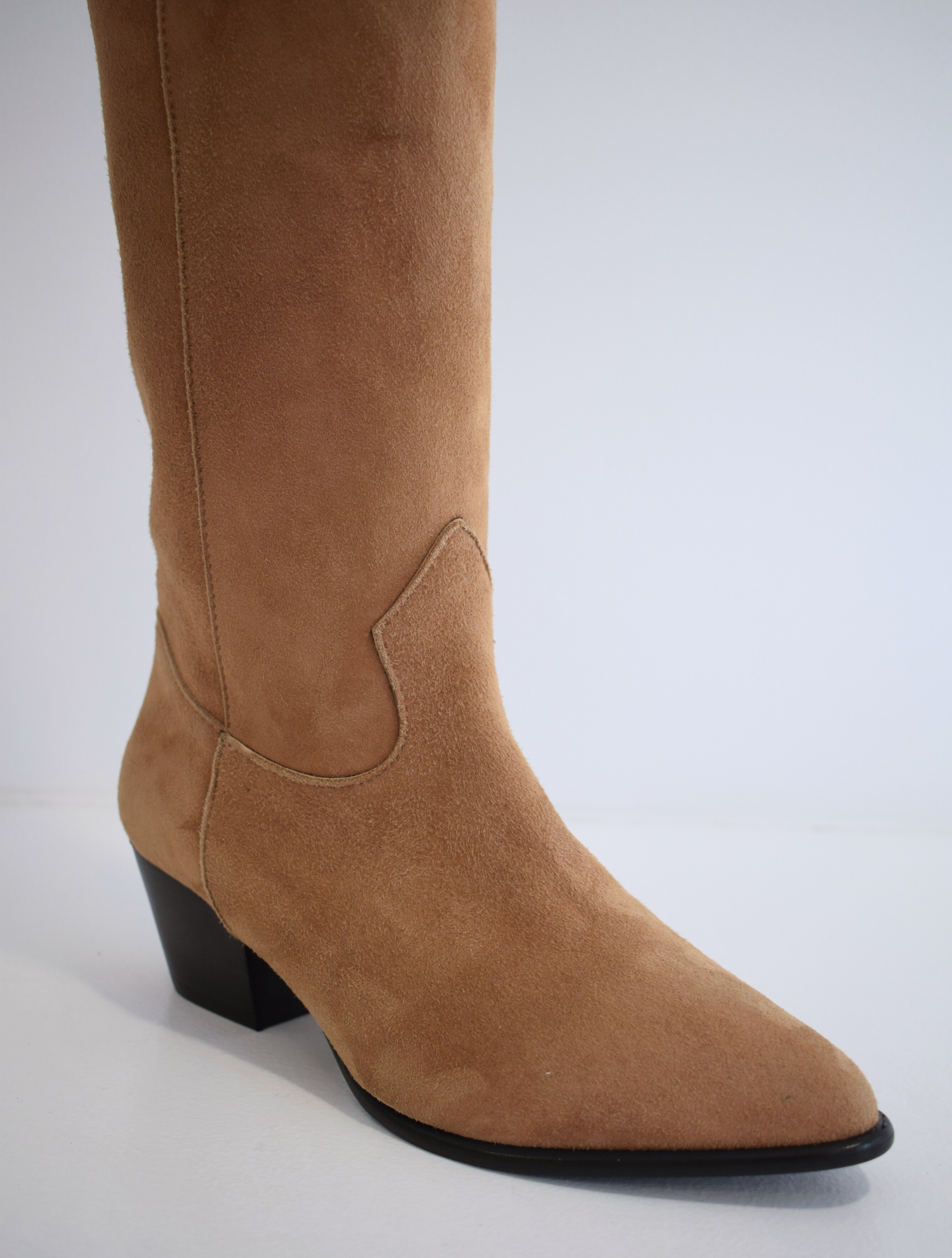 Sand coloured medium length pull on suede western inspired boot