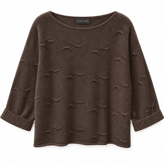 a flat lay of a chocolate brown cashmere knit with shorter length sleeves and wave detailing all over