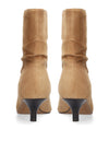 A pair of tan suede mid-calf boots with black kitten heels, shown from the back on a white background.