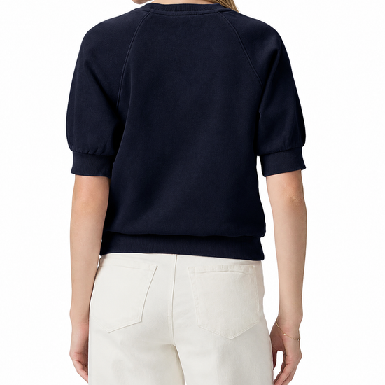 model wearing a navy blue short sleeve sweatshirt on a plain white background 
