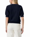model wearing a navy blue short sleeve sweatshirt on a plain white background 