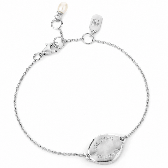 flat lay image of a silver bracelet