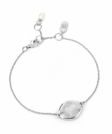 flat lay image of a silver bracelet