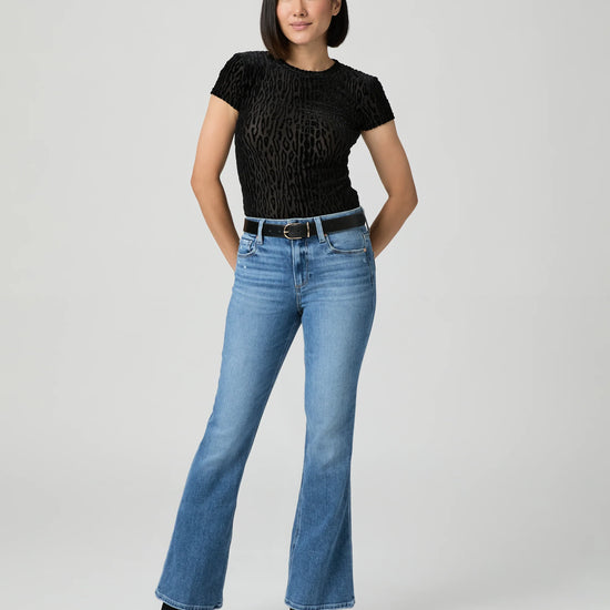 woman wearing blue Jeans by paige, showing full outfit.