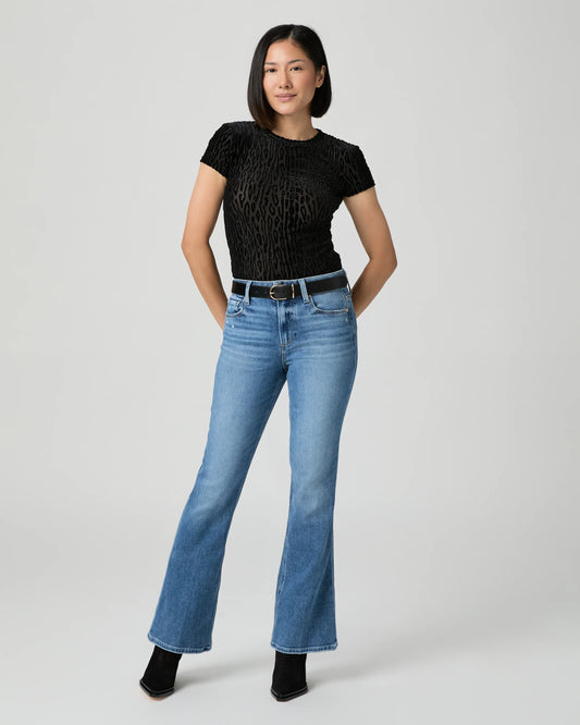 woman wearing blue Jeans by paige, showing full outfit.