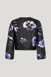 V neck collarless black long sleeved shirt in black with large purple pansy print