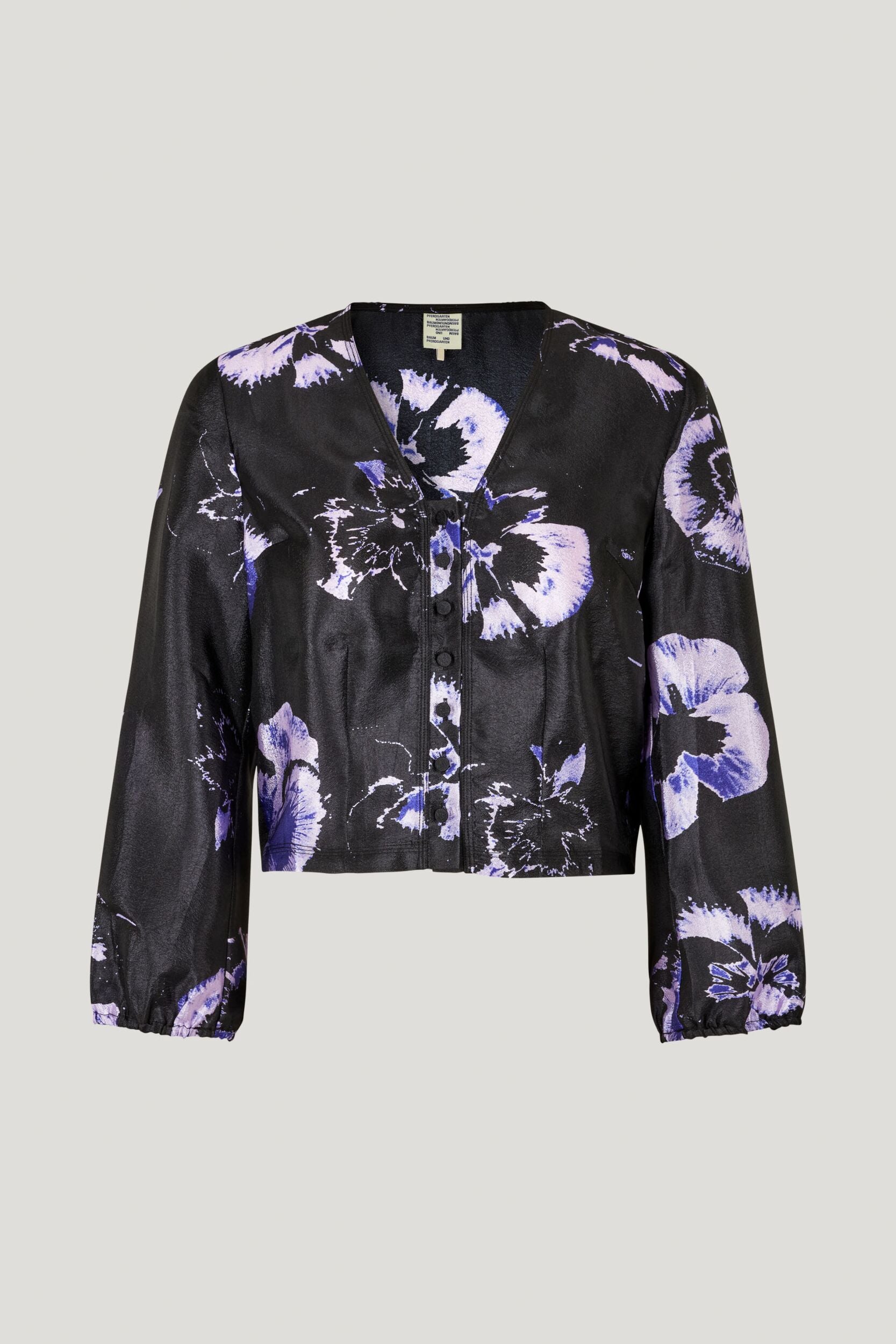 V neck collarless black long sleeved shirt in black with large purple pansy print