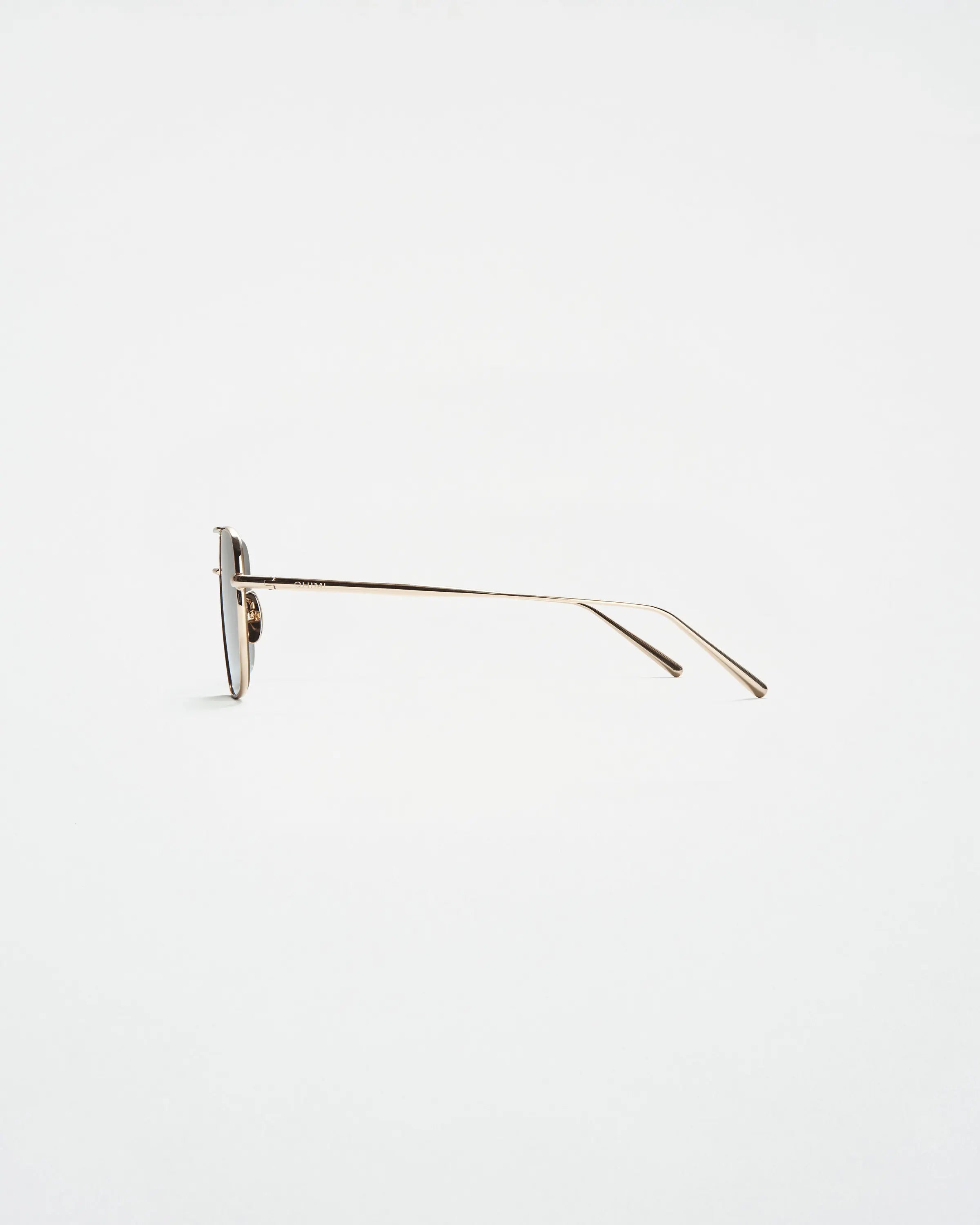 Gold coloured steel frame sunglasses with a square lense