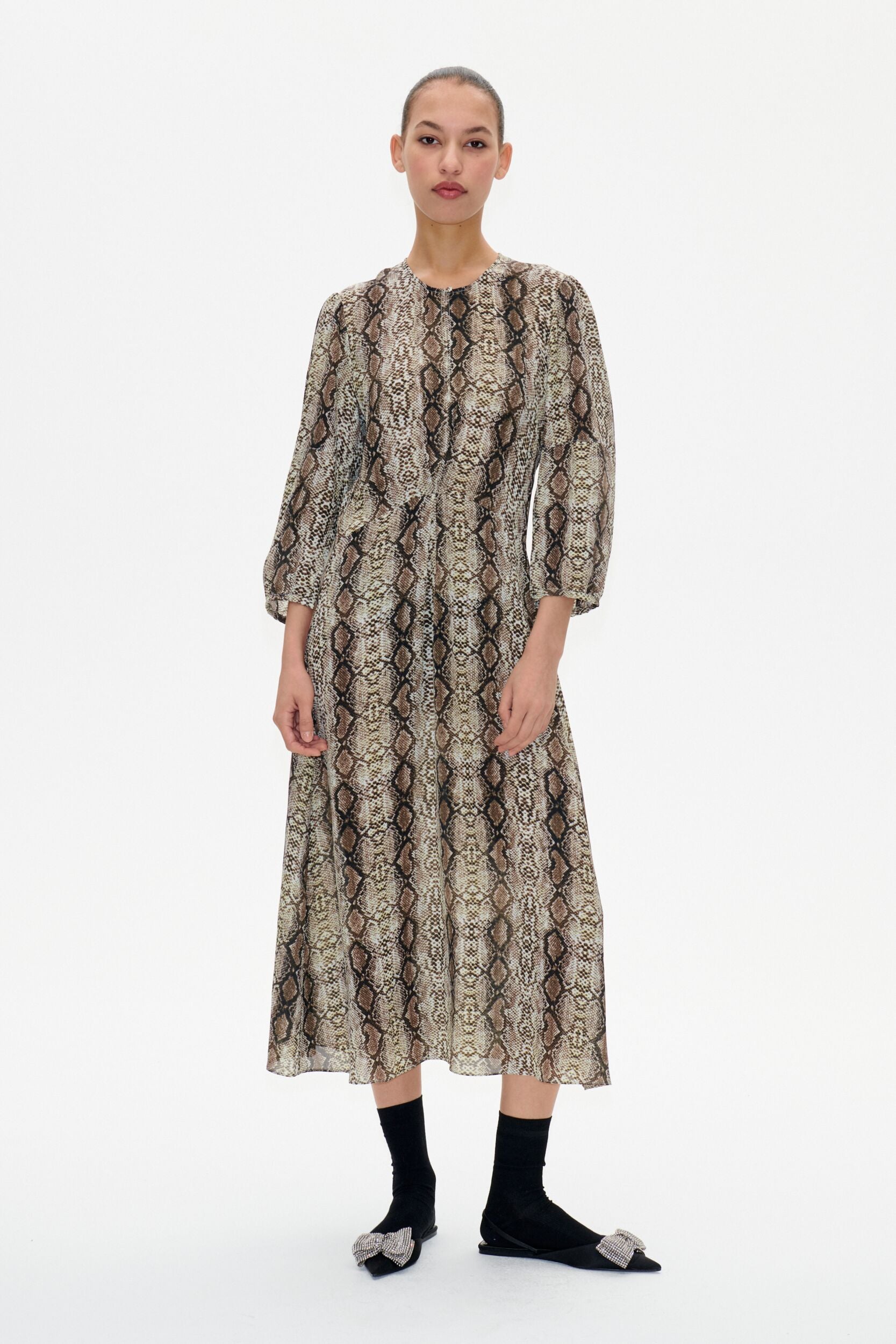 Snake print midi dress with crew neckline and bracelet length sleeves