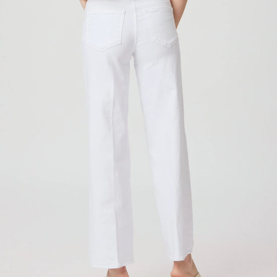 Straight cut white jeans with a high rise rear view