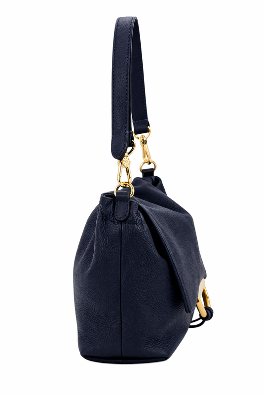 navy leather bag with gold accents on a white background