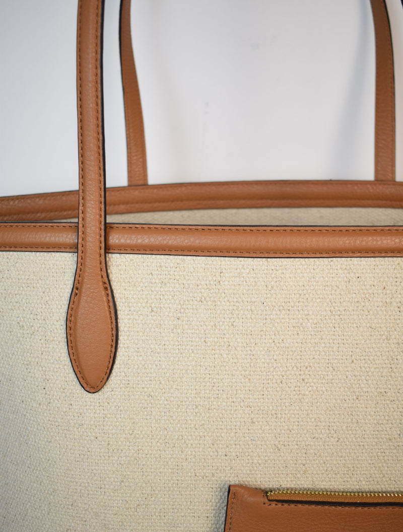 Neutral canvas totoe with tan leather trim