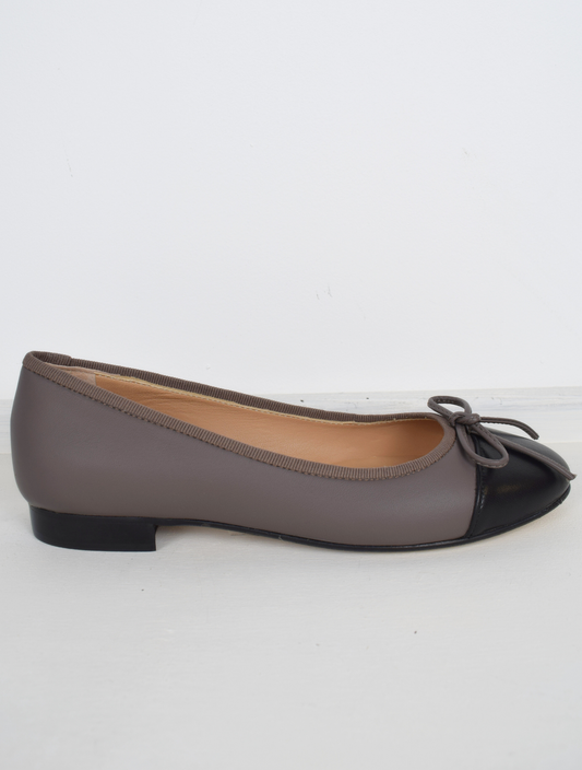 Taupe ballet pump with black toe and bow detail