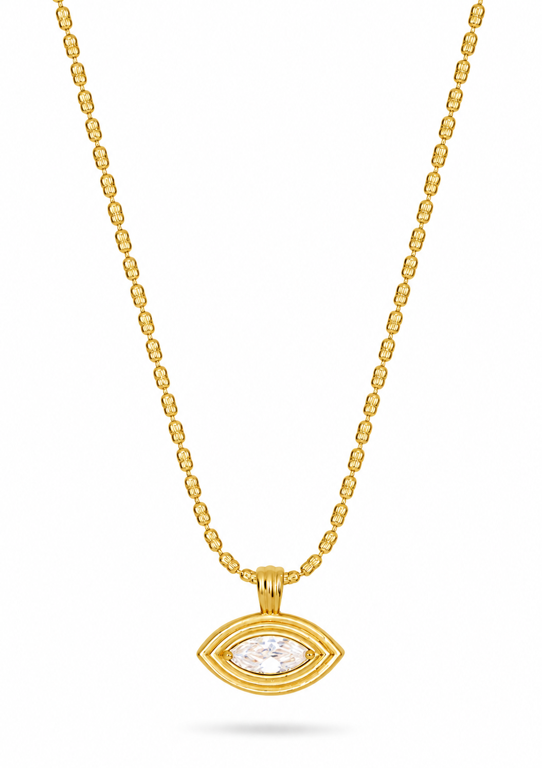 A gold chain necklace with a small oval pendant featuring a clear central stone, displayed against a plain white background.